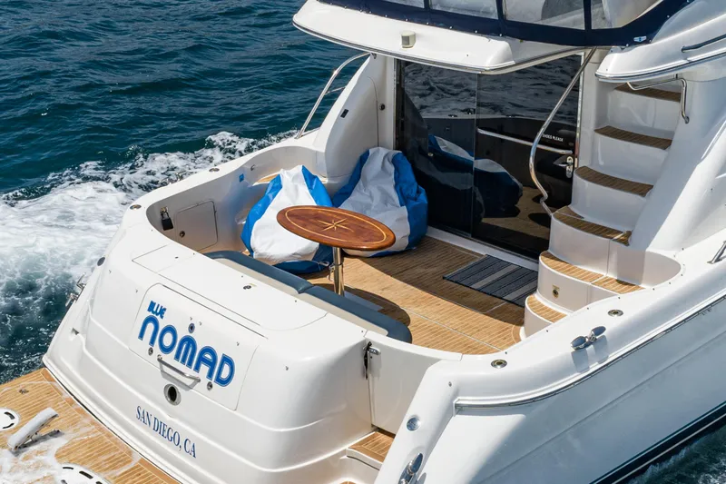 Slide: The Image of 2001 Sea Ray 560 Sedan Bridge yacht with outdoor seating, cruising in San Diego waters. - 34