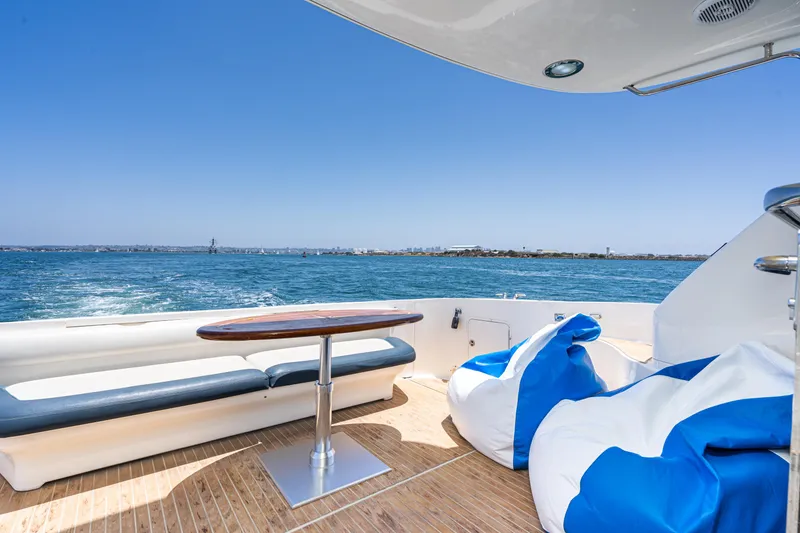 Slide: The Image of Luxurious 2001 Sea Ray 560 Sedan Bridge yacht deck with ocean view and seating. - 36