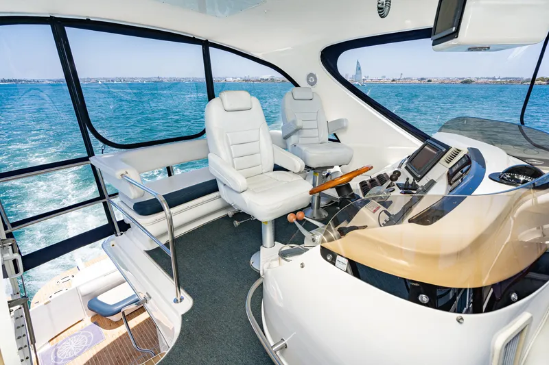 Slide: The Image of Luxurious 2001 Sea Ray 560 Sedan Bridge interior with panoramic ocean views. - 37