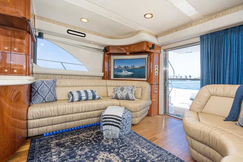 Slide: The Image of Luxurious interior of 2001 Sea Ray 560 Sedan Bridge yacht with plush seating and elegant decor. - 45