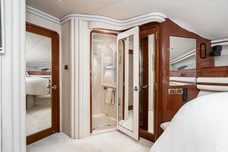 Slide: The Image of Luxurious interior of 2001 Sea Ray 560 Sedan Bridge yacht with elegant wood finishes. - 48