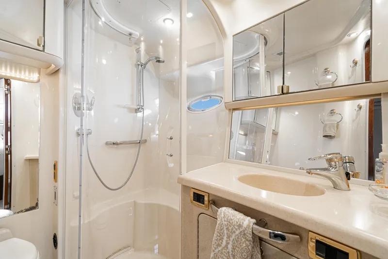 Slide: The Image of Luxurious bathroom in 2001 Sea Ray 560 Sedan Bridge yacht with shower and vanity. - 49