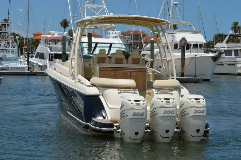Slide: The Image of 2016 Chris-Craft Launch 36 boat with triple 300 horsepower engines docked in marina. - 1