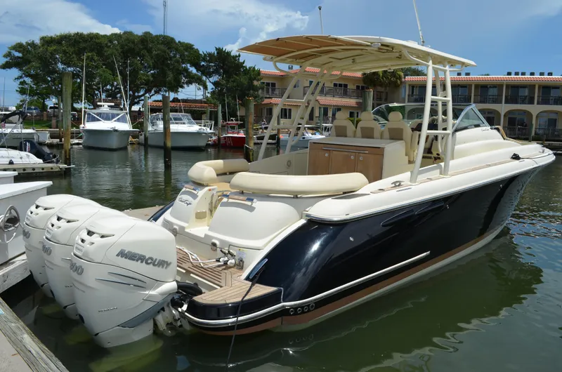 Slide: The Image of 2016 Chris-Craft Launch 36 boat docked with triple Mercury engines. - 21