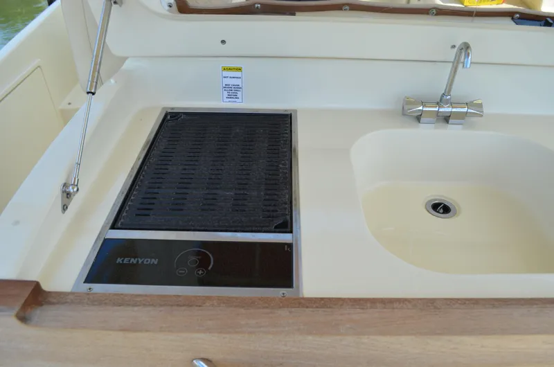 Slide: The Image of 2016 Chris-Craft Launch 36 boat kitchen with Kenyon grill and sink. - 23