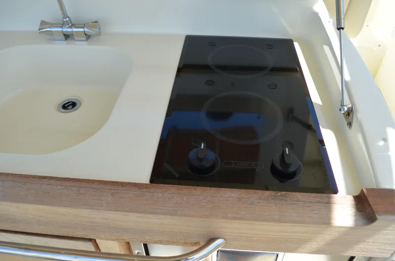 Slide: The Image of 2016 Chris-Craft Launch 36 boat kitchen with sink and stovetop. - 25