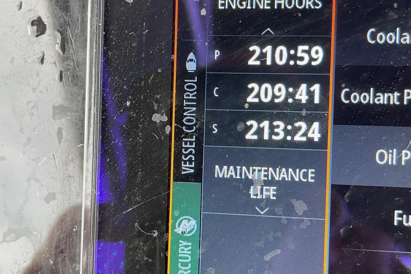Slide: The Image of Display screen showing engine hours and maintenance life on a 2016 Chris-Craft Launch 36. - 34