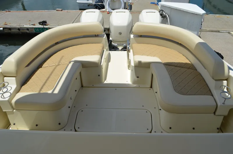 Slide: The Image of 2016 Chris-Craft Launch 36 boat with beige seating, docked at a marina. - 8