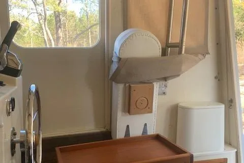 Slide: The Image of 2002 Rosborough RF-246 Custom Wheelhouse interior with sink and cushioned seating. - 7