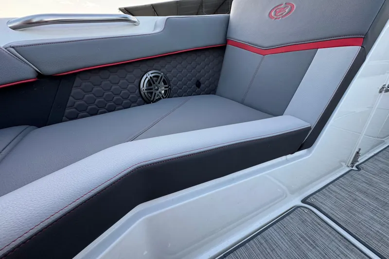 Slide: The Image of 2023 Cobalt R4 Surf boat interior with stylish seating and speaker detail. - 16