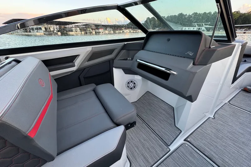 Slide: The Image of 2023 Cobalt R4 Surf boat interior with sleek seating and modern dashboard design. - 17