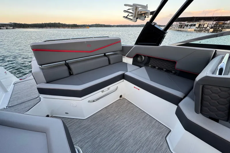Slide: The Image of 2023 Cobalt R4 Surf boat interior with sleek gray seating and modern design. - 19