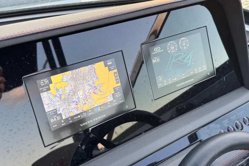 Slide: The Image of Dashboard of 2023 Cobalt R4 Surf boat with navigation and control screens. - 20