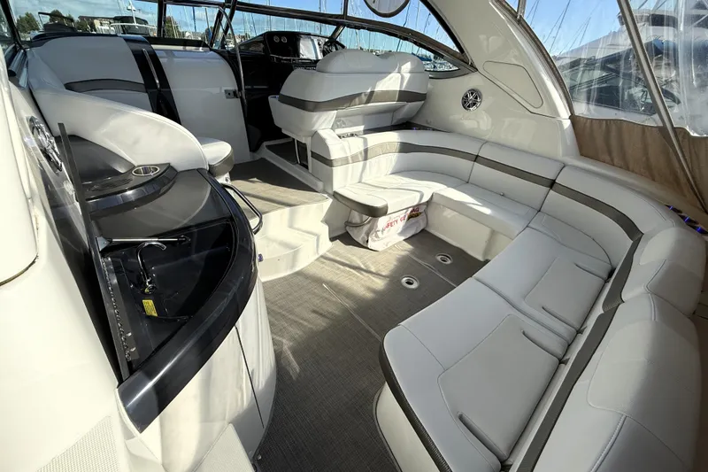 Slide: The Image of 2018 Formula 37 Performance Cruiser interior with white seating and a central table. - 10