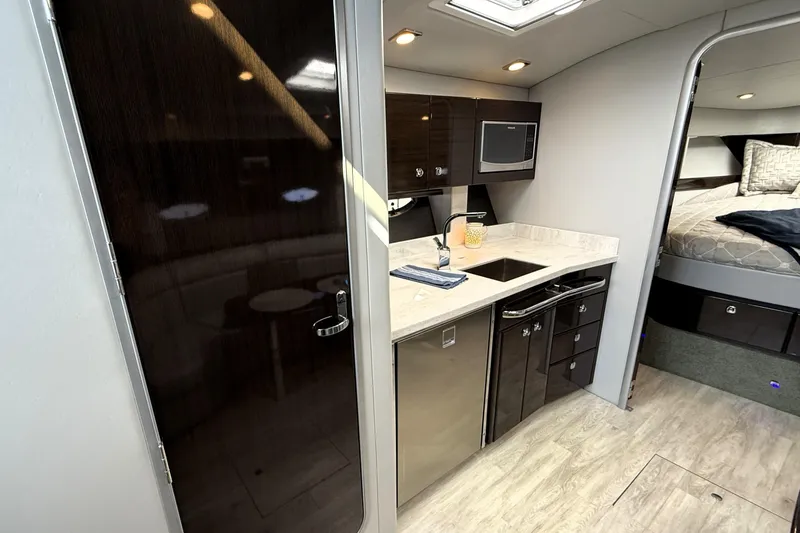 Slide: The Image of 2018 Formula 37 Performance Cruiser anchor compartment with winch and storage. - 26