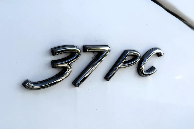 Slide: The Image of 2018 Formula 37 Performance Cruiser docked in a marina under clear blue skies. - 8