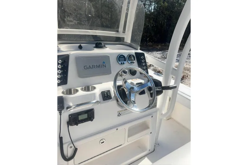Slide: The Image of 2017 Robalo 246 Cayman boat console with Garmin navigation system and steering wheel. - 6