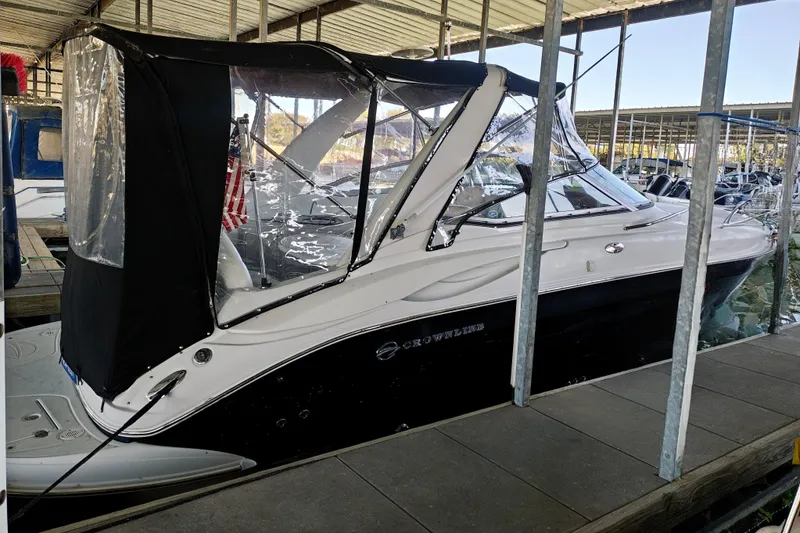 Slide: The Image of 2004 Crownline 270 CR boat docked with canopy cover in marina. - 20