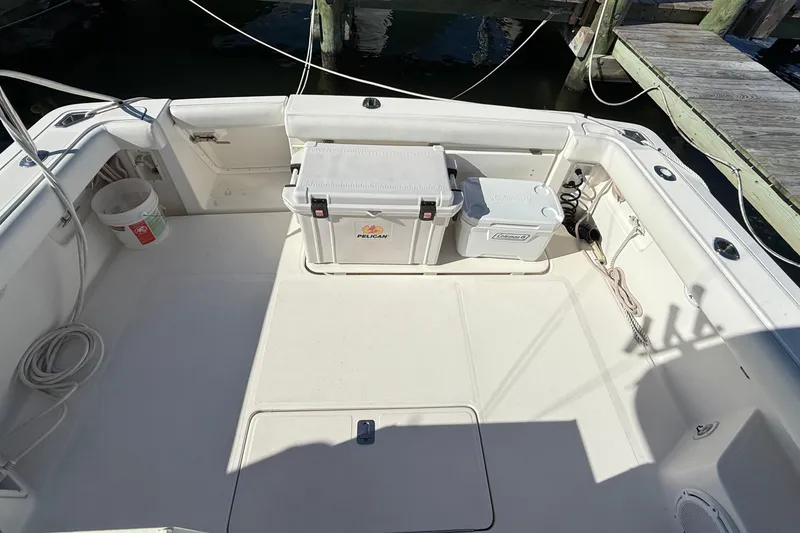 Slide: The Image of 2003 Tiara Yachts 3500 Open cockpit with coolers and storage, docked at marina. - 12