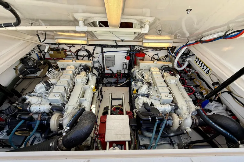 Slide: The Image of Engine room of a 2003 Tiara Yachts 3500 Open, showcasing dual engines and mechanical components. - 30