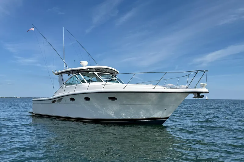 Slide: The Image of 2003 Tiara Yachts 3500 Open boat on calm ocean under clear blue sky. - 5