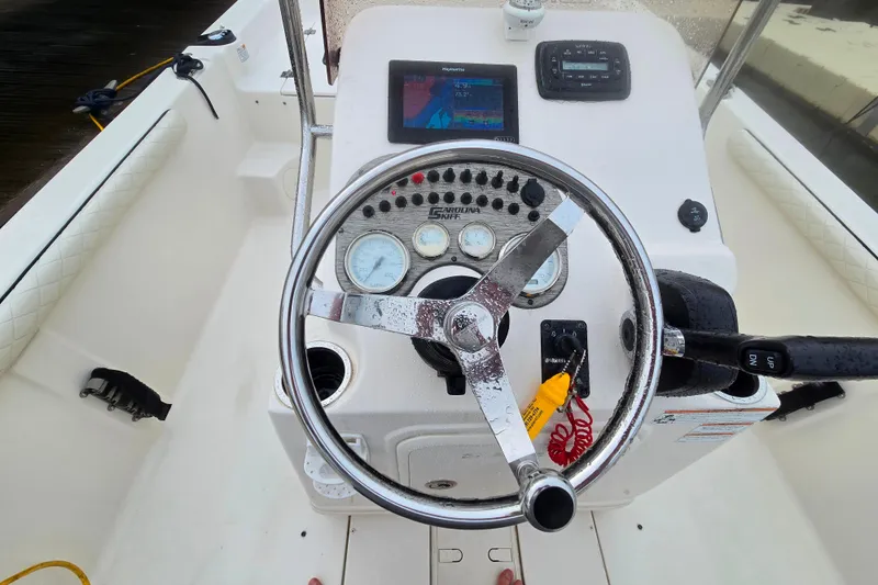 Slide: The Image of 2021 Carolina Skiff 19 LS boat interior with steering console and controls. - 12