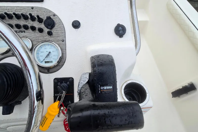 Slide: The Image of 2021 Carolina Skiff 19 LS boat dashboard with steering wheel and Ray marine MFD - 13