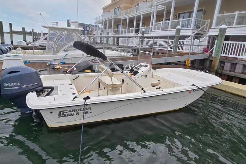 Slide: The Image of 2021 Carolina Skiff 19 LS boat dashboard with Yamaha controls and gauges. - 14