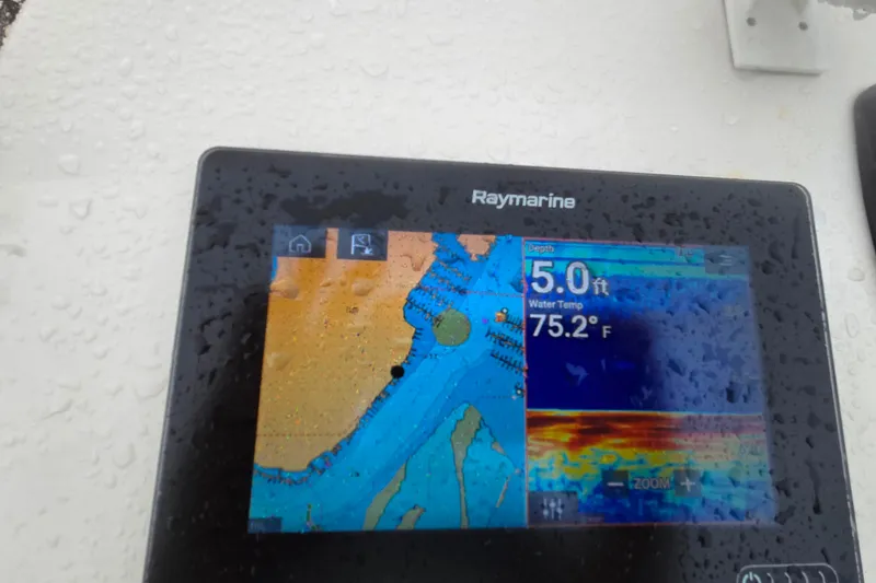 Slide: The Image of Raymarine display on 2021 Carolina Skiff 19 LS showing depth and water temperature. - 16