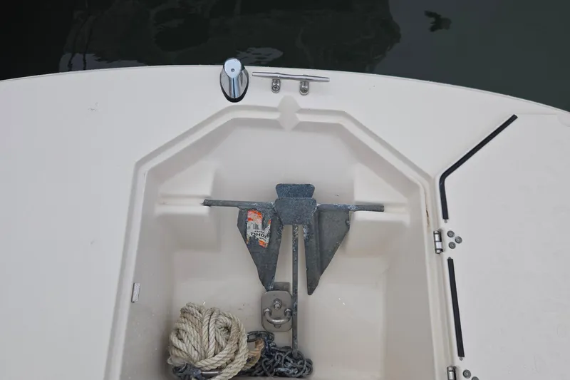 Slide: The Image of Anchor compartment of 2021 Carolina Skiff 19 LS with rope and anchor. - 17