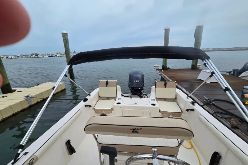 Slide: The Image of 2021 Carolina Skiff 19 LS boat interior with steering console and seating. - 4
