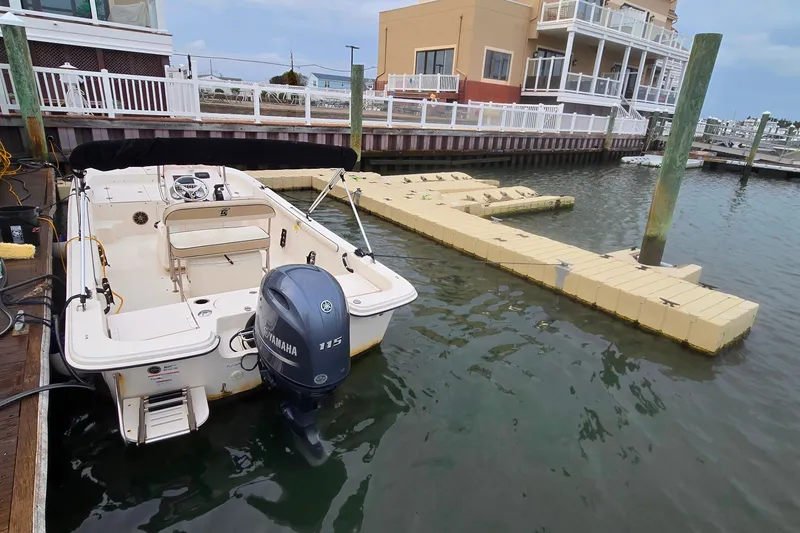 Slide: The Image of 2021 Carolina Skiff 19 LS boat interior with steering console and seating. - 8