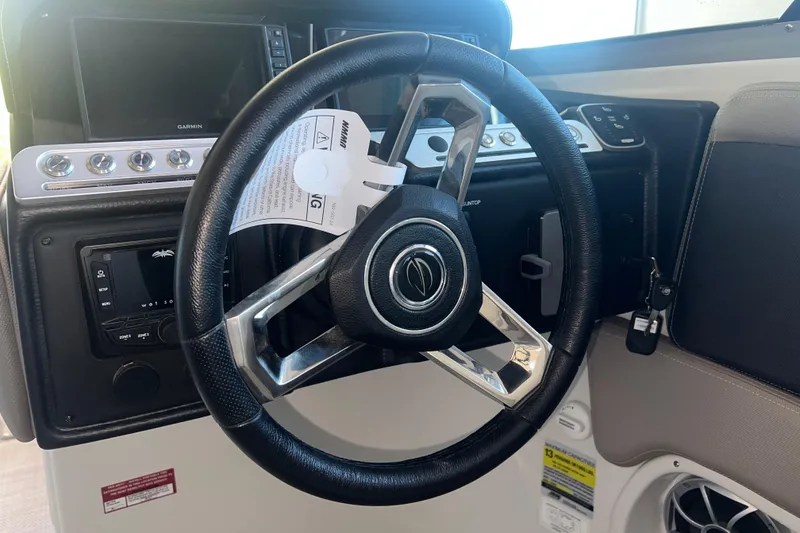 Slide: The Image of 2026 Crownline Eclipse E260 XS interior detail with key and speaker. - 18