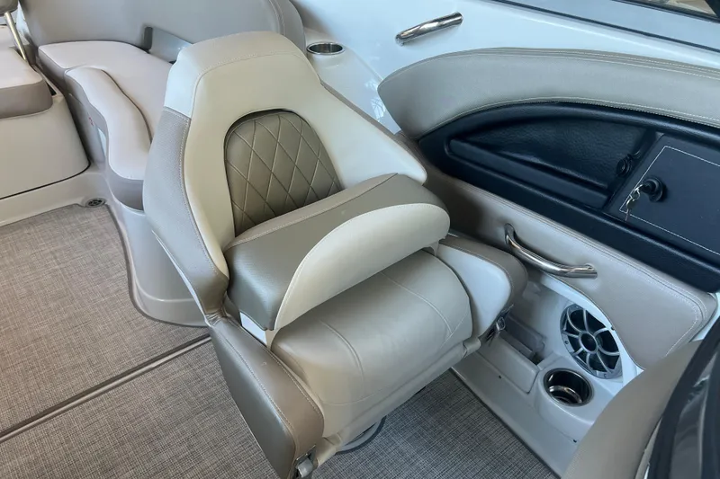 Slide: The Image of 2026 Crownline Eclipse E260 XS boat interior with gray quilted seats and modern design. - 25