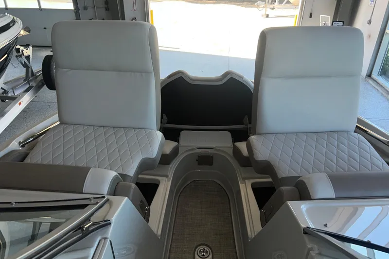 Slide: The Image of 2026 Crownline Eclipse E260 XS boat interior with sleek seating and modern dashboard design. - 30