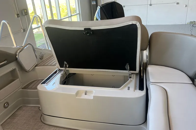 Slide: The Image of 2026 Crownline Eclipse E260 XS boat interior with modern dashboard and seating. - 31