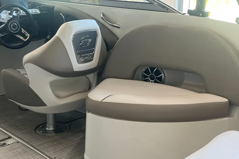 Slide: The Image of 2026 Crownline Eclipse E260 XS boat with Mercury engine, showcasing sleek design and luxury seating. - 35