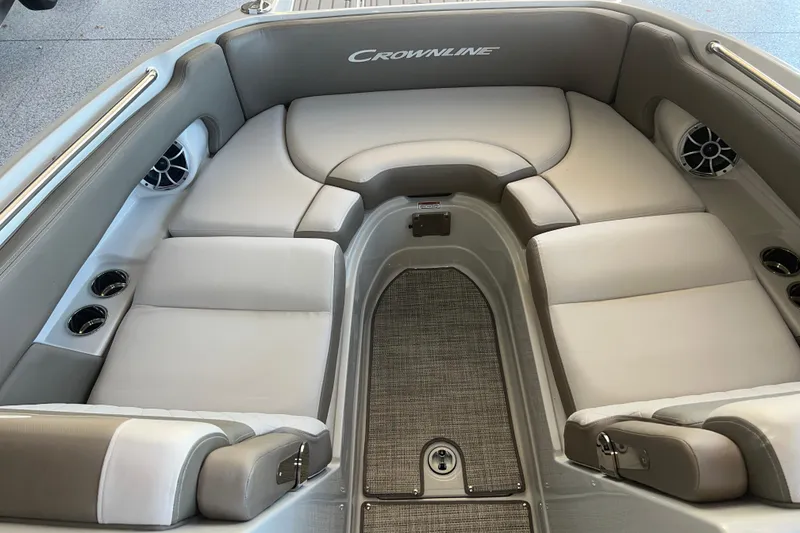 Slide: The Image of 2026 Crownline Eclipse E260 XS boat interior with spacious seating and storage compartment. - 6
