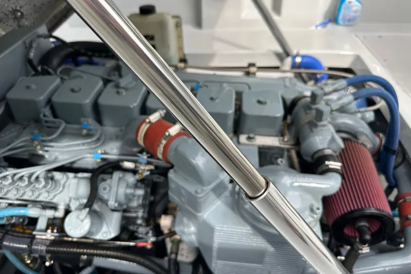 Slide: The Image of 2004 SeaVee Center Console engine compartment with visible components and metallic details. - 20