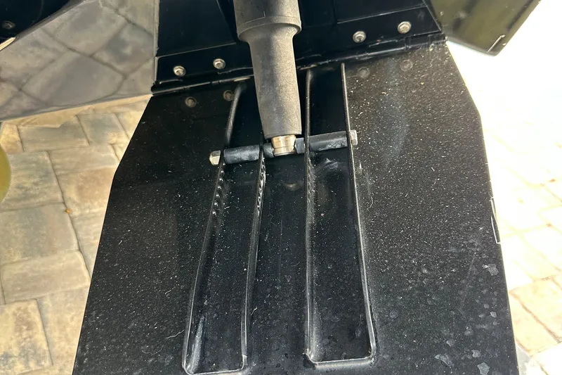 Slide: The Image of Close-up of a 2004 SeaVee Center Consol boat component, showing detailed hardware. - 42