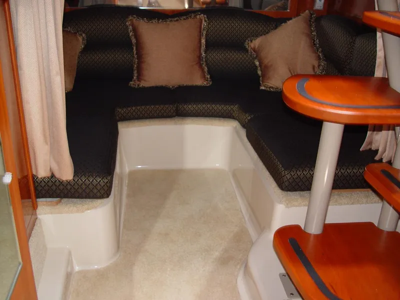 Slide: The Image of 2006 Four Winns 348 Vista yacht helm with steering wheel, gauges, and navigation equipment. - 12