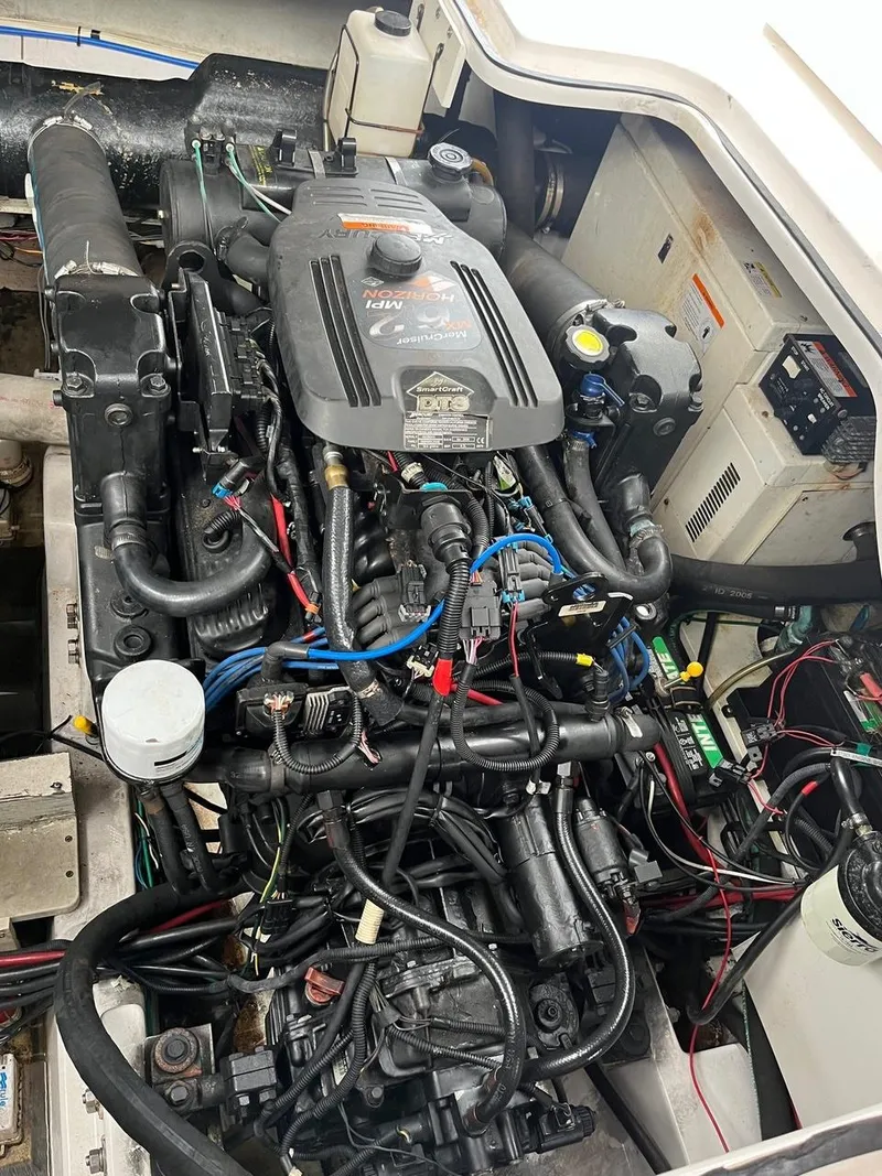 Slide: The Image of Interior of 2006 Four Winns 348 Vista yacht with wood cabinetry and cozy seating. - 13