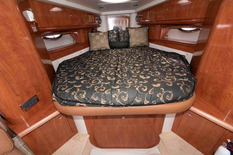 Slide: The Image of Luxurious cabin interior of 2006 Four Winns 348 Vista yacht with elegant bedding. - 16