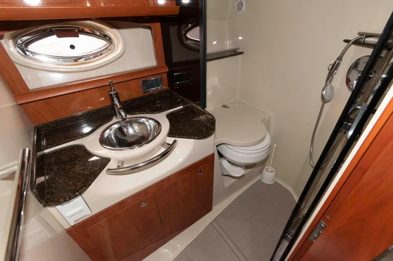 Slide: The Image of Luxurious 2006 Four Winns 348 Vista yacht bathroom with modern fixtures and elegant wood accents. - 18