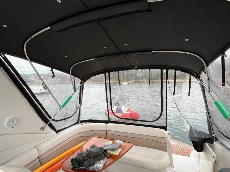 Slide: The Image of 2006 Four Winns 348 Vista boat on calm water under cloudy sky. - 4