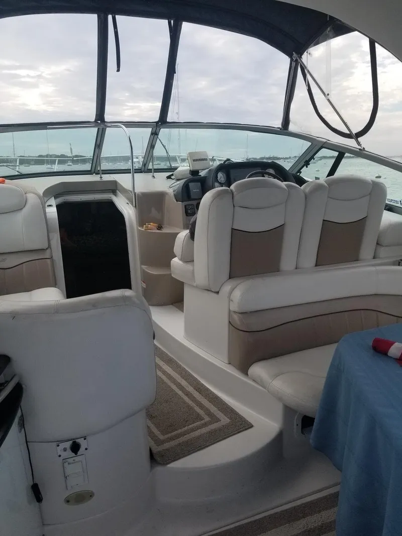 Slide: The Image of 2006 Four Winns 348 Vista boat interior with white seating and helm. - 5