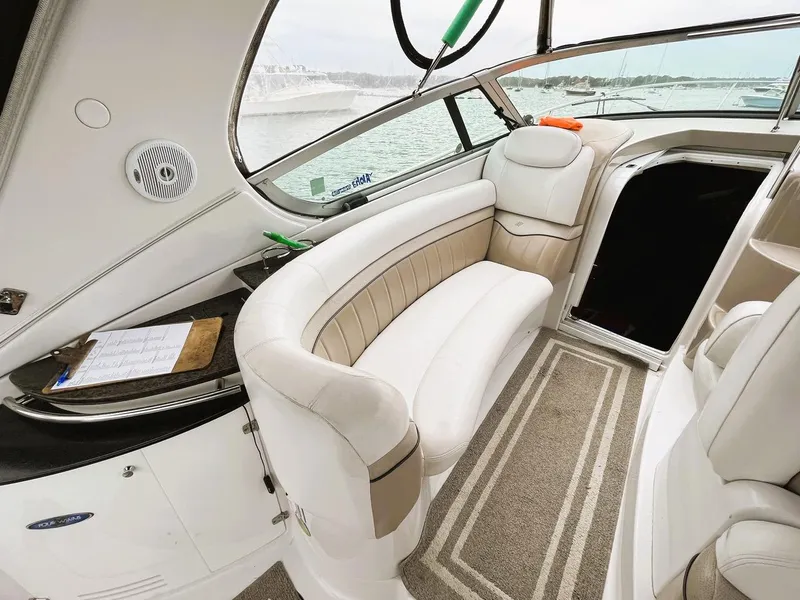 Slide: The Image of Interior of 2006 Four Winns 348 Vista boat with plush seating and helm. - 6