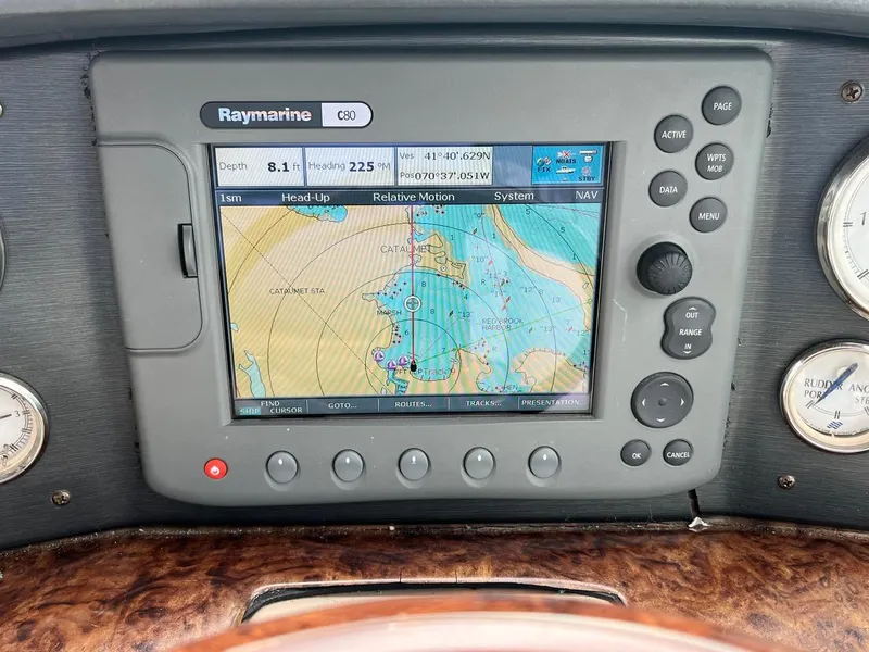 Slide: The Image of Interior of 2006 Four Winns 348 Vista boat with white seating and control panel. - 7