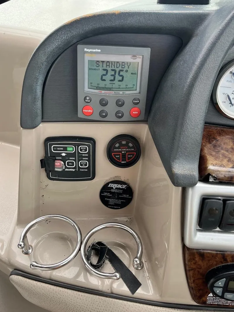 Slide: The Image of 2006 Four Winns 348 Vista boat interior with beige and white seating arrangement. - 9