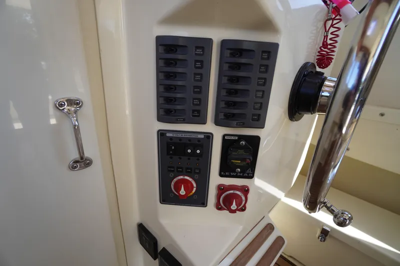 Slide: The Image of Control panel of 2016 Rosborough 246 Dingby boat with steering wheel and switches. - 11